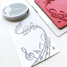 將圖片載入圖庫檢視器 Catherine Pooler - Background Stamp - On Staff. Add some dancing notes to your card background with the On Staff Background Stamp. This red rubber stamp features a winding music staff pattern with notes and musical icons. Available at Embellish Away located in Bowmanville Ontario Canada.