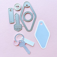Load image into Gallery viewer, Catherine Pooler - Dies - Suite Motel Key. Create your own Suite Motel Key set with these fun dies. The dies include a key die, tags and "metal" keyring dies for so many fun layering options. Available at Embellish Away located in Bowmanville Ontario Canada.