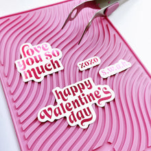 Load image into Gallery viewer, Catherine Pooler - Hot Foil Plates and Dies - Sweet Nothings. Add a foiled sentiment to your next Valentine project with the Sweet Nothings Hot Foil Plates. Featuring a large "love you so much" and "happy Valentine's day" , a small "s.w.a.k" and "xoxo". Available at Embellish Away located in Bowmanville Ontario Canada. Example by brand ambassador.