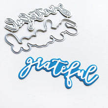 Charger l'image dans la galerie, Catherine Pooler - Layered Word Dies - Grateful. This two-piece die give you multiple options for using the die alone or with a background layer. Add your favorite embossing powder or medium for extra sparkle and shine. Available at Embellish Away located in Bowmanville Ontario Canada.