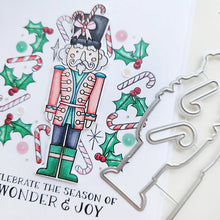 Cargar imagen en el visor de la galería, Catherine Pooler - Stamp & Die Set - Nutcracker Sweet. Meet the cutest nutcrackers in town! This whimsical set features charming nutcrackers adorned in a delightful array of sweets and treats, including cupcakes, candy canes, and figgy pudding. Available at Embellish Away located in Bowmanville Ontario Canada.