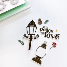 गैलरी व्यूवर में इमेज लोड करें, Catherine Pooler - Stamp & Die Set - Warm & Bright. Light glowing works of art, lamps and lanterns are a classic icon of warmth and home. Features these images with candles and greenery to "decorate" them for the winter season. Available at Embellish Away located in Bowmanville Ontario Canada.