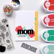 Load image into Gallery viewer, Catherine Pooler - Word Die - Just Mom. Send a card to your favorite mom! The Just Mom Word Die is a simple block font "mom" that will be a cute addition to any card for mother's day or any day celebrating your best lady! Take the "m" and cut one hump off to create "mum"! The Mom Word Die measures approx. 3" x 1". Illustrated by Lisa Kirkbride. Available at Embellish Away located in Bowmanville Ontario Canada. Card by brand ambassador.