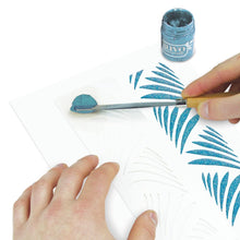 將圖片載入圖庫檢視器 Nuvo - Glimmer Paste - 1.7 oz. Nuvo Glimmer Paste can provide unique variety to your work. Use in combination with any stencil to create dimensional strip designs or bring texture and sparkle to larger areas and projects. The high concentration of glitter is sure to add a vibrant shimmer to whatever you are creating. Available at Embellish Away located in Bowmanville Ontario Canada. Turquoise Topaz example.
