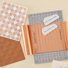 Load image into Gallery viewer, Spellbinders - Glimmer Foil Roll - Satin Rose Gold. Glimmer hots add stunning and eye-catching foil designs to any project from paper crafts to mixed media and more! The foils are exclusively designed to be used with the Spellbinders Glimmer Hot Foil System. Available at Embellish Away located in Bowmanville Ontario Canada.