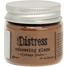 Load image into Gallery viewer, Tim Holtz - Distress Embossing Glaze - Vintage Photo. Add dimension to your projects with new embossing glaze! These translucent embossing powders are ideal for layering on surfaces. This package contains .49oz of embossing glaze. Conforms to ASTM D 4236. Comes in a variety of colors. Each sold separately. Made in USA. Available at Embellish Away located in Bowmanville Ontario Canada.