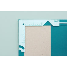 Cargar imagen en el visor de la galería, We R Memory - Book Cover Guide - Mint. Perfect book board placement, consistent gaps, trim corners at the proper angle, easily round corners and mark spot for elastic closure. It also includes a scan code for detailed instructions. Available at Embellish Away located in Bowmanville Ontario Canada.
