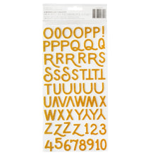 Load image into Gallery viewer, American Crafts - Thickers Stickers - 141/Pkg - Alpha Gold Glitter - April &amp; Ivy. Introducing April and Ivy by American Crafts- a paper collection that effortlessly combines vintage allure, eclectic flair, and vibrant energy. Available at Embellish Away located in Bowmanville Ontario Canada.
