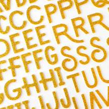 Load image into Gallery viewer, American Crafts - Thickers Stickers - 141/Pkg - Alpha Gold Glitter - April &amp; Ivy. Introducing April and Ivy by American Crafts- a paper collection that effortlessly combines vintage allure, eclectic flair, and vibrant energy. Available at Embellish Away located in Bowmanville Ontario Canada.
