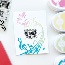 將圖片載入圖庫檢視器 Catherine Pooler - Background Stamp - On Staff. Add some dancing notes to your card background with the On Staff Background Stamp. This red rubber stamp features a winding music staff pattern with notes and musical icons. Available at Embellish Away located in Bowmanville Ontario Canada. Card example by brand ambassador.
