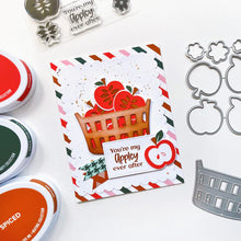 Load image into Gallery viewer, Catherine Pooler - Die - Bushel Basket. Fill up the Bushel Basket Die with some die cut apples from the Appley Ever After Stamp &amp; Die Set. This embossed die cut image makes a farm-style basket that makes a great element to your card and fall projects. Available at Embellish Away located in Bowmanville Ontario Canada. Example by brand ambassador.
