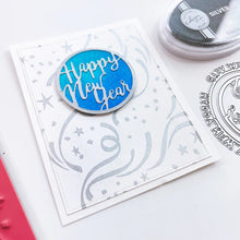Load image into Gallery viewer, Catherine Pooler - Die - Round of New Year. Add a New Year's greeting with the Round of New Year Dies. This pair of circle word dies can be used together or separately. Layer them with the Circle Dies for festive shaker options. Available at Embellish Away located in Bowmanville Ontario Canada. Example by brand ambassador.
