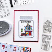 Load image into Gallery viewer, Catherine Pooler - Patterned Paper - Bedford Falls. This paper pack features patterns and prints of life in a sleepy little town. Featuring a print of houses and people out walking their dogs along with post boxes, letters, and snow topped topiaries! Available at Embellish Away located in Bowmanville Ontario Canada. Example by brand ambassador.
