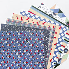 Load image into Gallery viewer, Catherine Pooler - Patterned Paper - Bobby Soxer. The Bobby Soxer Patterned Paper is inspired by life and music of the 1940's. Tweed, tiny flowers and argyle socks- this paper pack has fabric and textile inspired patterns and music inspired prints! Available at Embellish Away located in Bowmanville Ontario Canada.
