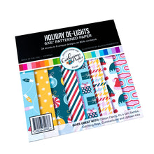 Cargar imagen en el visor de la galería, Catherine Pooler - Patterned Paper - Holiday De-Lights. When trimming the tree, don't forget the holiday de-lights! The Holiday De-Lights Patterned Paper is a quintessential holiday mix of patterns and prints! Available at Embellish Away located in Bowmanville Ontario Canada.

