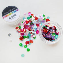 Load image into Gallery viewer, Catherine Pooler - Sequin Mix - Reykjavik. Reykjavík Sequin Mix adds a touch of playful elegance to your holiday projects. This iridescent mix features vibrant red and green sequins with soft pops of pink and icy blue. Available at Embellish Away located in Bowmanville Ontario Canada.
