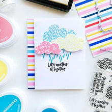 Load image into Gallery viewer, Catherine Pooler - Stamp &amp; Die Set - April Showers. Use the four (4) dies in the April Showers Dies set to cut out the clouds from the April Showers Stamp Set for lots of pattern play. Illustrated by Elizabeth Silver.  Available at Embellish Away located in Bowmanville Ontario Canada. Example by brand ambassador.

