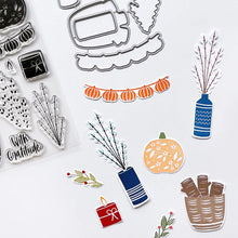 Load image into Gallery viewer, Catherine Pooler - Stamp &amp; Die Set - Bless This House. Create a card inspired by the latest fall themed home decor trends with this Set. This set features warm and cozy fireside decor images like candles, a vase and basket of wood. Available at Embellish Away located in Bowmanville Ontario Canada. Example by brand ambassador.
