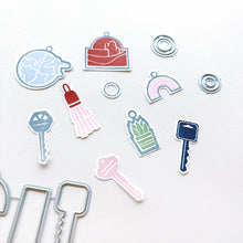 Load image into Gallery viewer, Catherine Pooler - Stamp &amp; Die Set - Charming Keys. For all of life's moments where you are moving up or moving out, we have the Charming Keys Stamp Set and Dies! Available at Embellish Away located in Bowmanville Ontario Canada.
