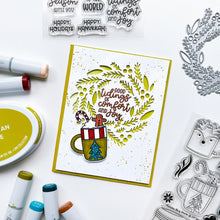 Load image into Gallery viewer, Catherine Pooler - Stamp &amp; Die Set - Holiday Mug. From the makers of the original Mug Shots Stamp Set comes Holiday Mug Shots Stamps and coordinating dies! Features all your favorite winter friends- Santa, Rudolf, Snowman and even the Gingerbread man. Available at Embellish Away located in Bowmanville Ontario Canada. Example by brand ambassador.
