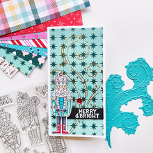 Cargar imagen en el visor de la galería, Catherine Pooler - Stamp &amp; Die Set - Nutcracker Sweet. Meet the cutest nutcrackers in town! This whimsical set features charming nutcrackers adorned in a delightful array of sweets and treats, including cupcakes, candy canes, and figgy pudding. Available at Embellish Away located in Bowmanville Ontario Canada. Example by Catherine Pooler Designs.

