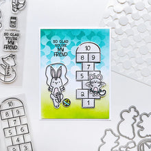 Load image into Gallery viewer, Catherine Pooler - Stamp &amp; Die Set - Recess. It's time for everybody's favorite subject-Recess! Grab the Recess Stamp Set and coordinating dies with all the essentials of nostalgic playground games like see-saw and hop scotch. Available at Embellish Away located in Bowmanville Ontario Canada. Example by brand ambassador.
