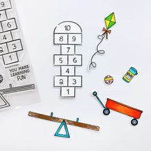 Load image into Gallery viewer, Catherine Pooler - Stamp &amp; Die Set - Recess. It's time for everybody's favorite subject-Recess! Grab the Recess Stamp Set and coordinating dies with all the essentials of nostalgic playground games like see-saw and hop scotch. Available at Embellish Away located in Bowmanville Ontario Canada.
