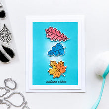 Load image into Gallery viewer, Catherine Pooler - Stamp &amp; Die Set - Stamp-a-Side Leaves. You will certainly fall for the Stamp-a-Side Leaves Stamp &amp; Die Set. You can stamp the whimsical patterned leaves with multiple ink colors or color the outline image with markers or blender pens. Available at Embellish Away located in Bowmanville Ontario Canada. Example by brand ambassador.
