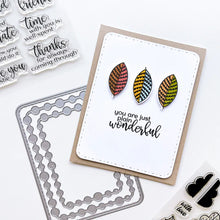 Load image into Gallery viewer, Catherine Pooler - Stamp &amp; Die Set - Stamp-a-Side Leaves. You will certainly fall for the Stamp-a-Side Leaves Stamp &amp; Die Set. You can stamp the whimsical patterned leaves with multiple ink colors or color the outline image with markers or blender pens. Available at Embellish Away located in Bowmanville Ontario Canada. Example by brand ambassador.
