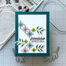 Load image into Gallery viewer, Gina K. Designs - Stamp &amp; Die Set - Friendship Blooms. Friendship Blooms is a stamp &amp; die set by Lisa Hetrick. This set is made of premium clear photopolymer and measures 6" X 8".  Made in the USA. Available at Embellish Away located in Bowmanville Ontario Canada. Example by brand ambassador.

