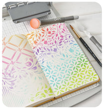 Load image into Gallery viewer, Sizzix - Layered Stencils by Willow Wolfe - Backgrounds (4pk). Available at Embellish Away located in Bowmanville Ontario Canada. Example by Willow Wolfe.
