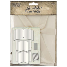 Load image into Gallery viewer, Tim Holtz - Idea-ology - Booklet Folio - 3.9"X5.4". Immerse yourself in the art of storytelling and nostalgia with the Tim Holtz Booklet Folio. Where every page you create tells a story, and unveils a cherished moment. Available at Embellish Away located in Bowmanville Ontario Canada.
