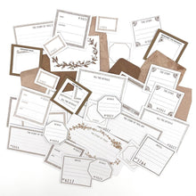 गैलरी व्यूवर में इमेज लोड करें, 49 And Market - Envelope Bits - Color Swatch - Toast. The Envelope Bits set is an assortment of 37 various pieces. 31 die-cut labels and bits are printed on cardstock. Pack also includes 6 paper mini envelopes. Available at Embellish Away located in Bowmanville Ontario Canada.
