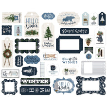 Load image into Gallery viewer, Carta Bella - Cardstock Ephemera 33/Pkg - Frames &amp; Tags - Welcome Winter. Coordinating: Kit 12X12, Pad 6X6, Solid Cardstock 12"X12", Ephemera - Frames &amp; Tags, Ephemera - Icons, Enamel Dots, Puffy Stickers, Chipboard 6X13 - Accents, Chipboard 6X13 - Phrases, Chipboard 6X13 - Frames, Decorative Brads. Available at Embellish Away located in Bowmanville Ontario Canada.

