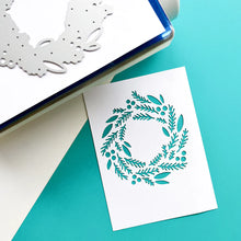 將圖片載入圖庫檢視器 Catherine Pooler - Die - Tree Trimmings. Once you've clipped the tree and made the wreath, you will have a nice collection of Tree Trimmings! This versatile die was created to cut a lovely focal point wreath out of your card layer. Available at Embellish Away located in Bowmanville Ontario Canada. Die cut example.
