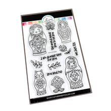 Cargar imagen en el visor de la galería, Catherine Pooler - Stamp &amp; Die Set - We Fit. You'll find charming folk art nesting dolls in the We Fit Stamp Set. This line art stamp set has 3 dolls and a cat doll that stamp along side one another from large to small! This set inspired by the art of Eastern Europe includes sweet sentiments like "the world needs you to be you" and "i am always here for you". Available at Embellish Away located in Bowmanville Ontario Canada.
