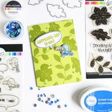 Load image into Gallery viewer, Catherine Pooler - Stamp and Die Set - In the Tropics Floral. Use the In the Tropics Floral Stamps and Dies for layers and layers of floral inspiration.  Illustrated by Kat Uno. Available at Embellish Away located in Bowmanville Ontario Canada. Card example by brand ambassador.
