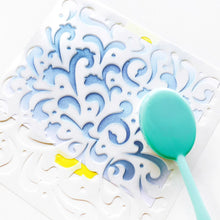 Load image into Gallery viewer, Catherine Pooler - Stencil - Secret Garden. A celebration of flourishes and blooms, the Secret Garden Stencil has a feel of a wild flower garden.  This beautiful, ornate pattern will give your card base so much interest.  Try this stencil with a favorite sparkly medium for more texture. Available at Embellish Away located in Bowmanville Ontario Canada.

