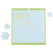 Charger l'image dans la galerie, Cricut - Cutting Mats 12"X12" - 2/Pkg - StandardGrip. This multi-purpose mat is perfect for a wide range of medium weight materials: patterned paper, vinyl, iron-on and cardstock. This package contains two 12x12 inch standard grip cutting mat. Imported. Available at Embellish Away located in Bowmanville Ontario Canada.
