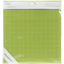 Charger l'image dans la galerie, Cricut - Cutting Mats 12"X12" - 2/Pkg - StandardGrip. This multi-purpose mat is perfect for a wide range of medium weight materials: patterned paper, vinyl, iron-on and cardstock. This package contains two 12x12 inch standard grip cutting mat. Imported. Available at Embellish Away located in Bowmanville Ontario Canada.
