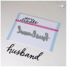 Cargar imagen en el visor de la galería, Heffy Doodle - Heffy Cuts Die - Husband. A standalone metal cutting die of the word ‘Husband’ in a hand lettered style. Measuring approximately 3" x 1". Available at Embellish Away located in Bowmanville Ontario Canada.
