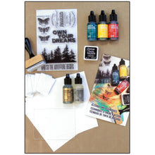 Load image into Gallery viewer, Ranger - Tim Holtz-Alcohol Ink Kit. This kit has everything you need to learn alcohol ink techniques and design your own projects. Follow along with quick and easy tips &amp; techniques, all with step by step instructions. Available at Embellish Away located in Bowmanville Ontario Canada.
