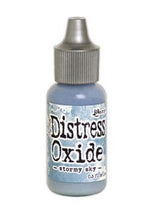 Charger l'image dans la galerie, Tim Holtz-Ranger Distress Oxides Reinkers. This water-reactive dye and pigment ink fusion creates an oxidized effect when sprayed with water. Use to re-ink Distress Oxide Ink Pads (sold separately). Available at Embellish Away located in Bowmanville Ontario Canada. Stormy Sky

