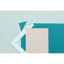 Cargar imagen en el visor de la galería, We R Memory - Book Cover Guide - Mint. Perfect book board placement, consistent gaps, trim corners at the proper angle, easily round corners and mark spot for elastic closure. It also includes a scan code for detailed instructions. Available at Embellish Away located in Bowmanville Ontario Canada.
