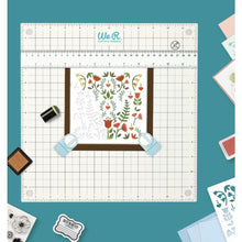 Charger l'image dans la galerie, We R Memory Keepers - All-In-One Magnetic Platform. The All-In-One Magnetic Platform is perfect for stenciling, aligning, embossing, and cutting. One side is an easy-clean work surface. Available at Embellish Away located in Bowmanville Ontario Canada.
