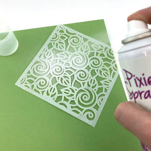 Load image into Gallery viewer, iCraft - Removable Pixie Spray For Stencils 3.8oz - Canada Version. Create flawless stenciled designs with Pixie Spray Stencil Adhesive! This light tack, repositionable adhesive gently holds stencils in place but wont tear paper or leave a sticky residue behind. Available at Embellish Away located in Bowmanville Ontario Canada.
